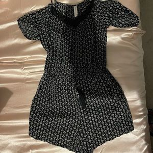 Never worn! Cute black romper with pockets, size medium fits like a small.